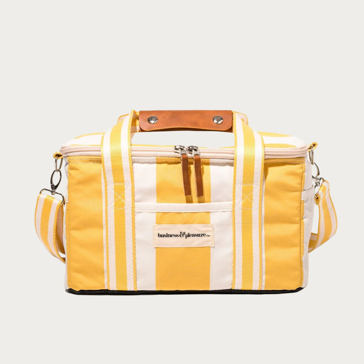 Yellow and white striped bag with brown handle on a white background