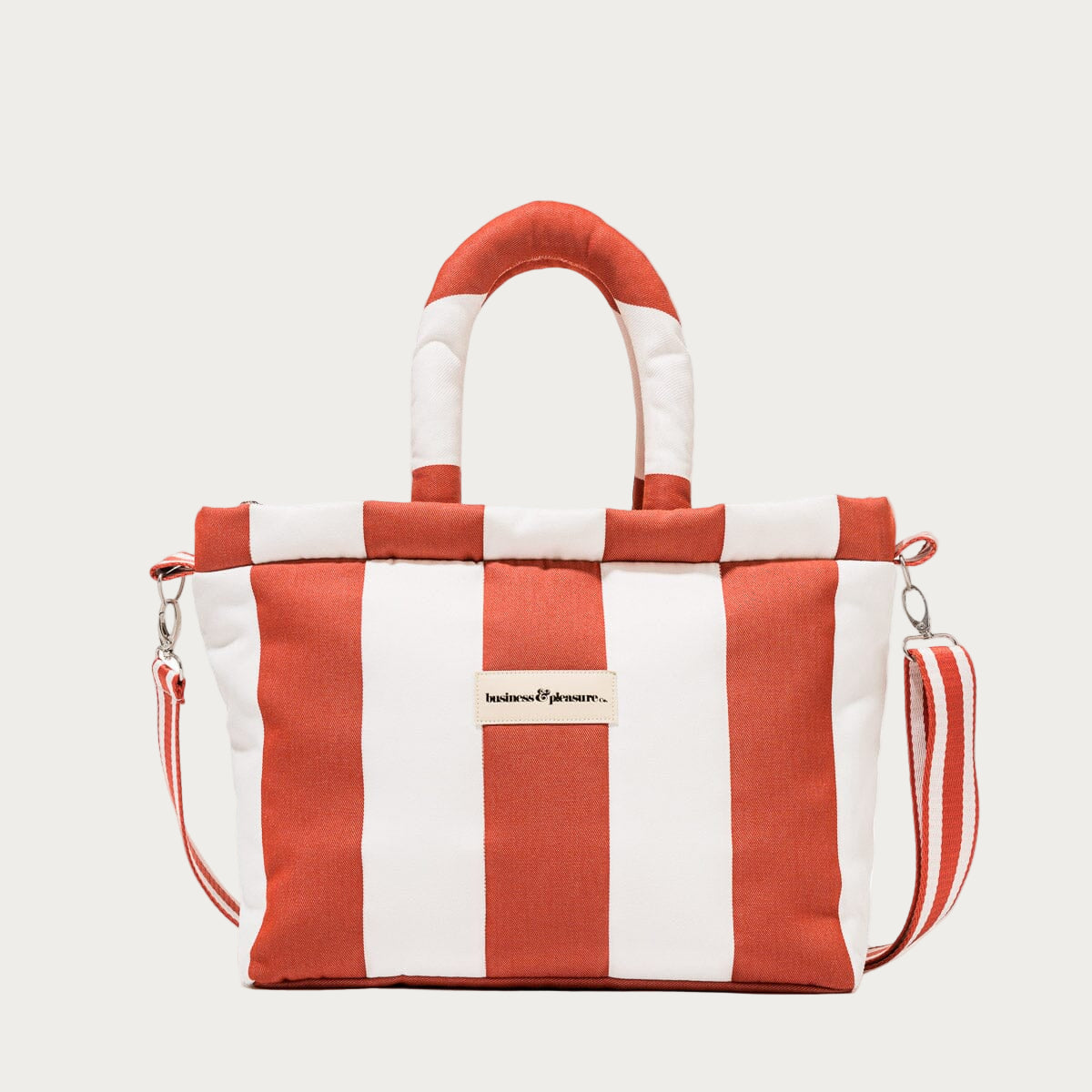 Red and white striped bag with a visible brand logo on a white background